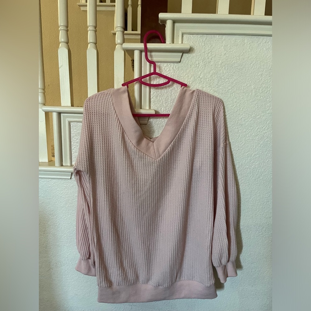 A light pink light weight sweater